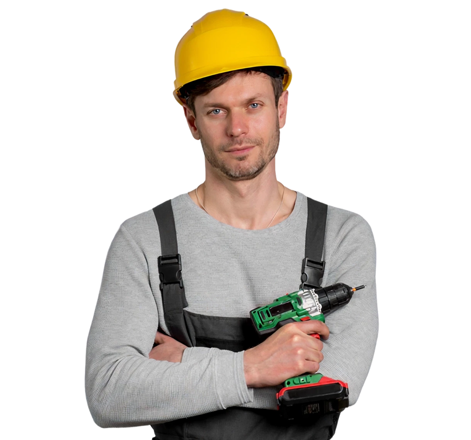 Construction worker with a yellow hard hat holding a cordless drill, ready for work.