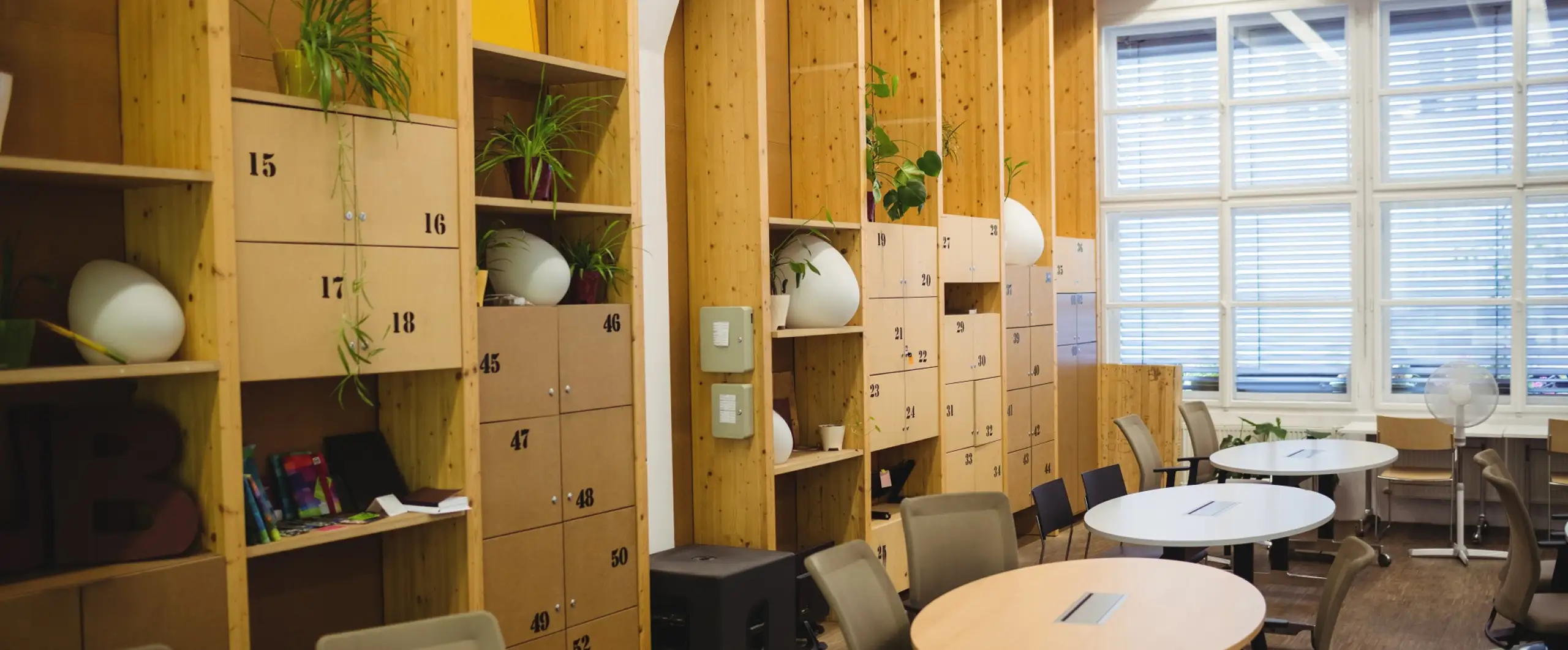 Commercial storage shelving with numbered cabinets in an office